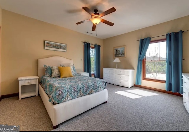 bedroom with ceiling fan, access to exterior, and carpet