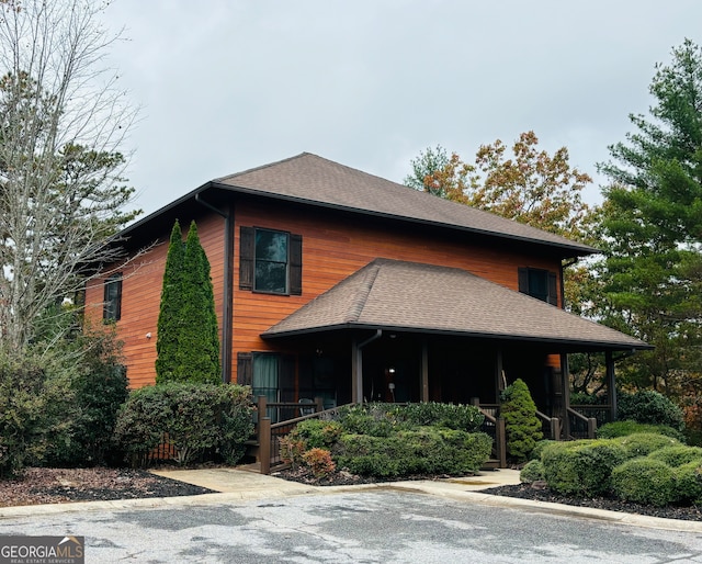 view of side of home featuring a porch