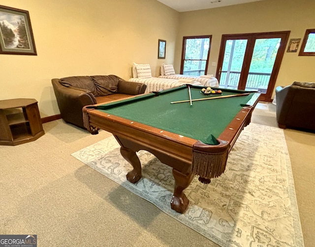 rec room with pool table and light carpet