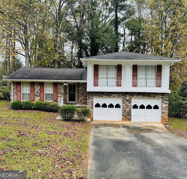 split level home with a balcony and a garage