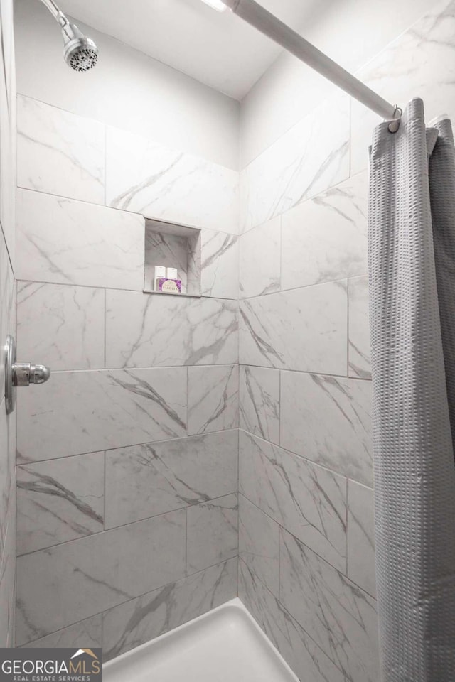 bathroom with a shower with curtain