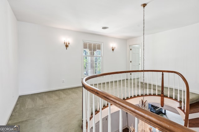 hallway featuring carpet