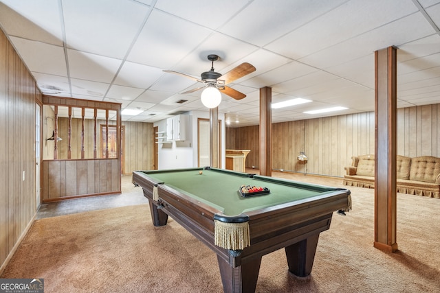 rec room featuring wood walls, pool table, light colored carpet, and a paneled ceiling