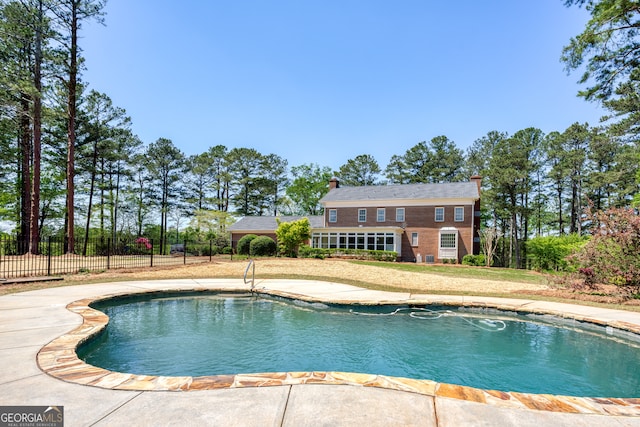 view of pool with a yard and a patio area