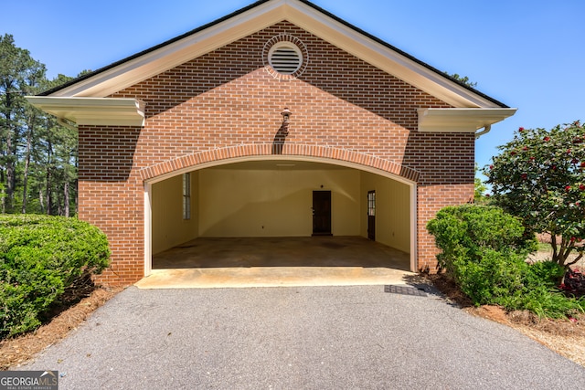 exterior space with a carport