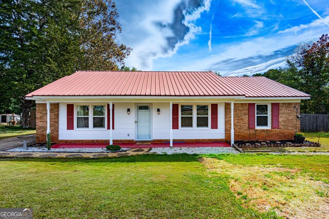 ranch-style house with a front lawn