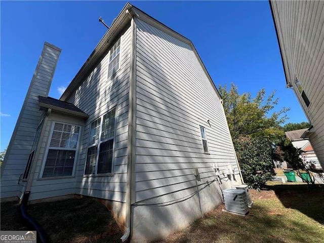 view of side of property with cooling unit