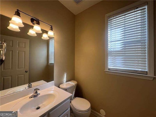 bathroom with vanity and toilet