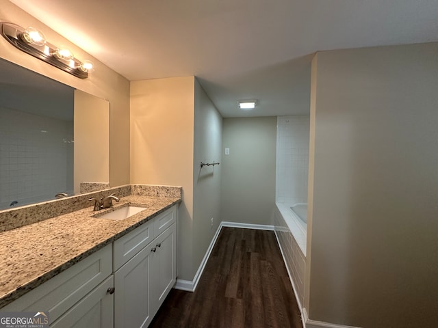 bathroom with wood-type flooring and vanity