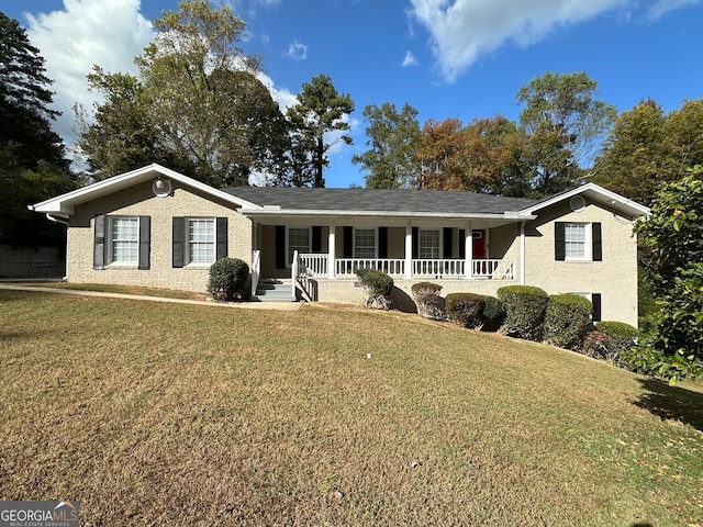 single story home with a front lawn and a porch