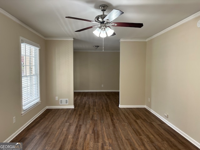 empty room with ornamental molding, dark wood-type flooring, and ceiling fan