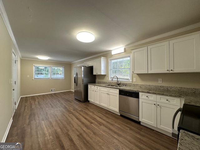 kitchen with stainless steel appliances, sink, light stone counters, dark hardwood / wood-style floors, and white cabinets