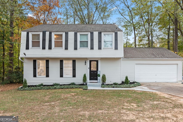 view of front of house with a garage and a front yard