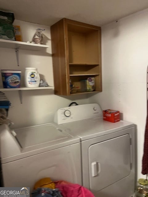 laundry room with washer and clothes dryer