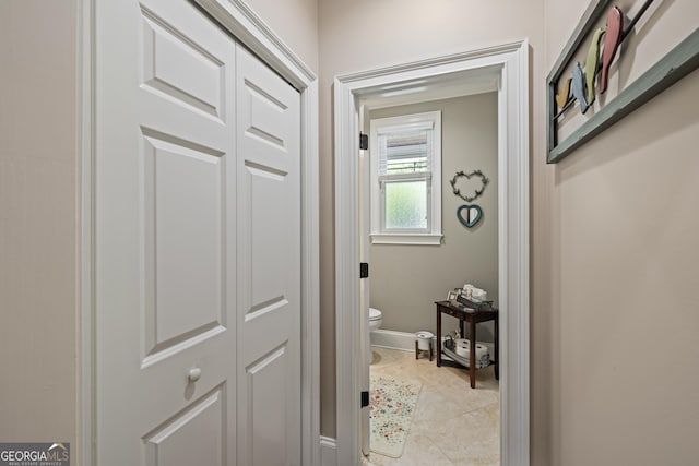 bathroom featuring toilet and tile patterned floors