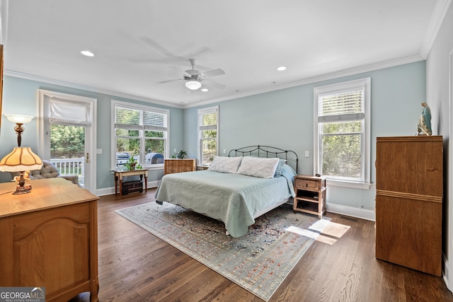 bedroom with dark wood-type flooring, ornamental molding, multiple windows, and ceiling fan