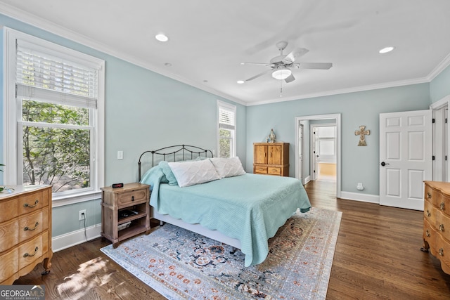 bedroom featuring dark wood-type flooring, ceiling fan, multiple windows, and ornamental molding