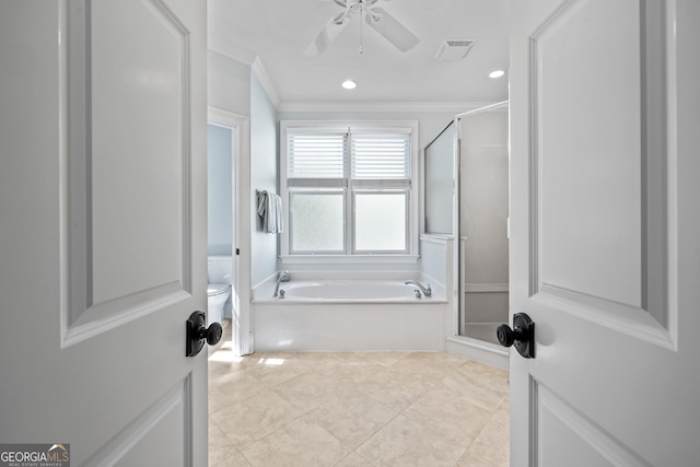 bathroom featuring ornamental molding, independent shower and bath, tile patterned flooring, toilet, and ceiling fan