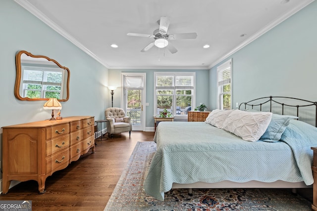 bedroom with dark hardwood / wood-style flooring, ceiling fan, and crown molding