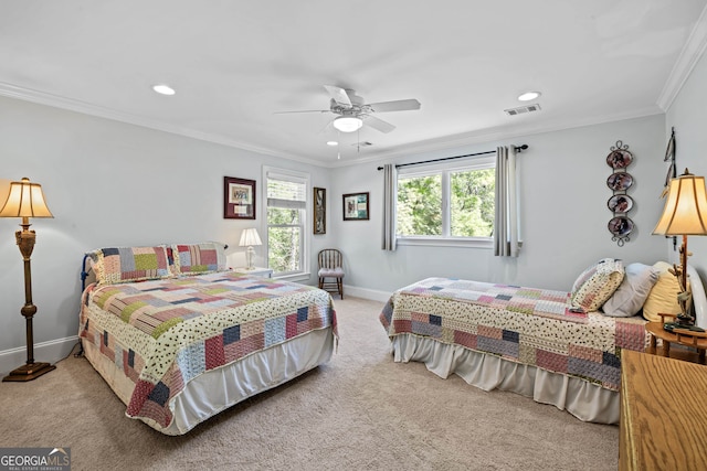 carpeted bedroom with ceiling fan and crown molding