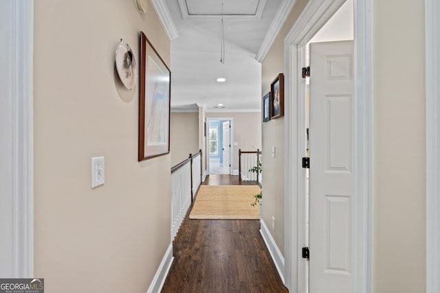 hall with ornamental molding and dark wood-type flooring