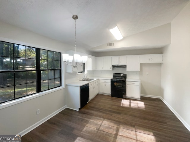 kitchen with black appliances, plenty of natural light, hanging light fixtures, and white cabinets