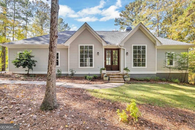 ranch-style home with a front lawn