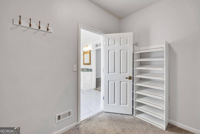 spacious closet featuring carpet