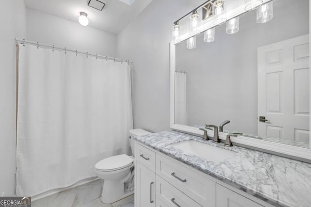 bathroom featuring vanity, toilet, and a shower with curtain