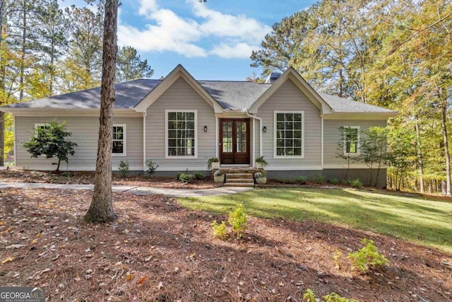 single story home featuring a front lawn