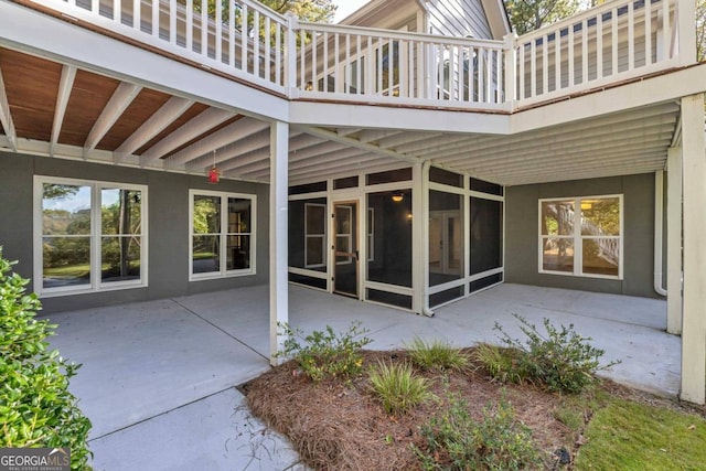 view of patio featuring a balcony