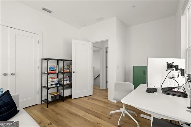 home office featuring light hardwood / wood-style flooring