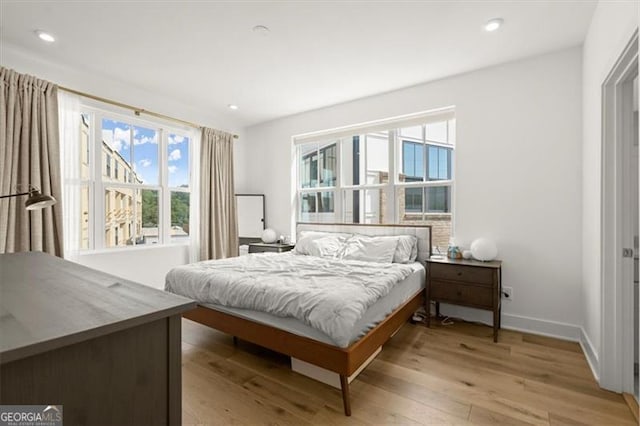 bedroom with light wood-type flooring