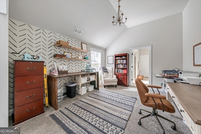 home office with an inviting chandelier, vaulted ceiling, and light colored carpet