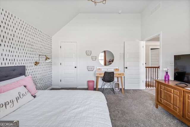 bedroom featuring high vaulted ceiling and carpet floors