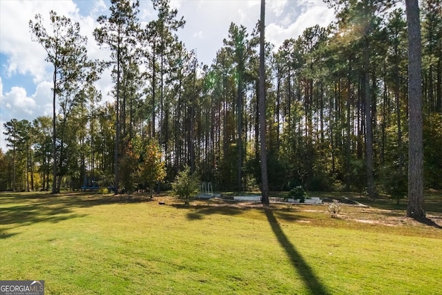 view of home's community featuring a lawn