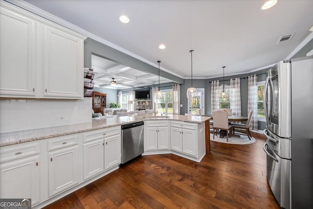 kitchen with stainless steel appliances, white cabinetry, kitchen peninsula, ceiling fan, and dark hardwood / wood-style flooring