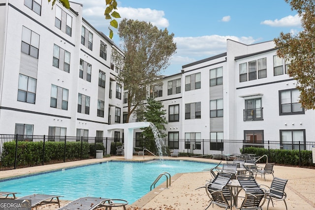 view of swimming pool featuring pool water feature