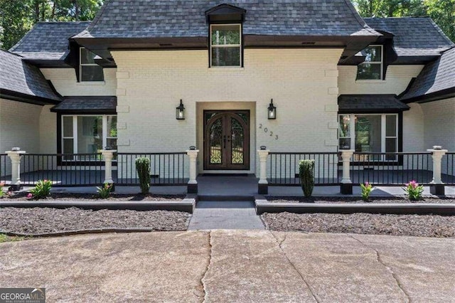 doorway to property featuring a porch