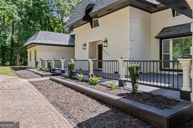 view of side of home with a porch