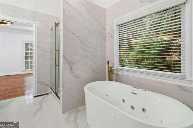 bathroom with shower with separate bathtub