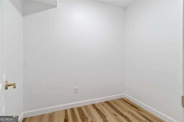 unfurnished room featuring hardwood / wood-style floors