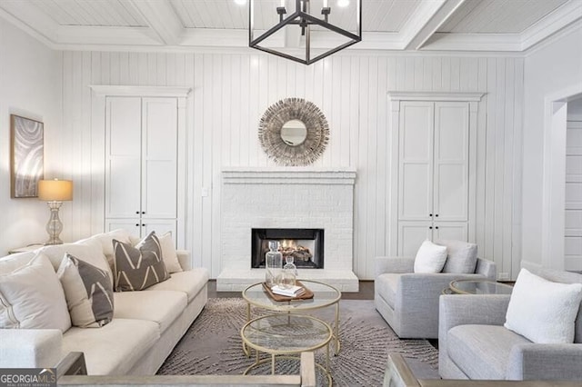 885 Crabapple Hl, Milton, GA 30004 - living room featuring a fireplace, ornamental molding, beam ceiling, and a chandelier