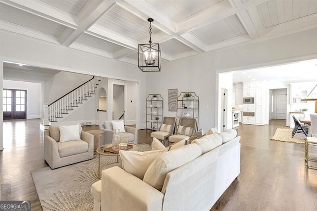 885 Crabapple Hl, Milton, GA 30004 - living room with beamed ceiling, wood-type flooring, coffered ceiling, and an inviting chandelier