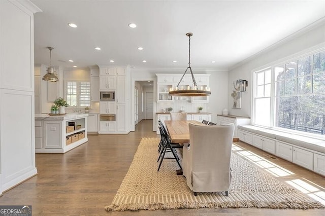 885 Crabapple Hl, Milton, GA 30004 - dining room with crown molding, wood-type flooring, and a chandelier