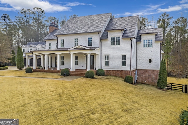 view of front of home with a front lawn and covered porch