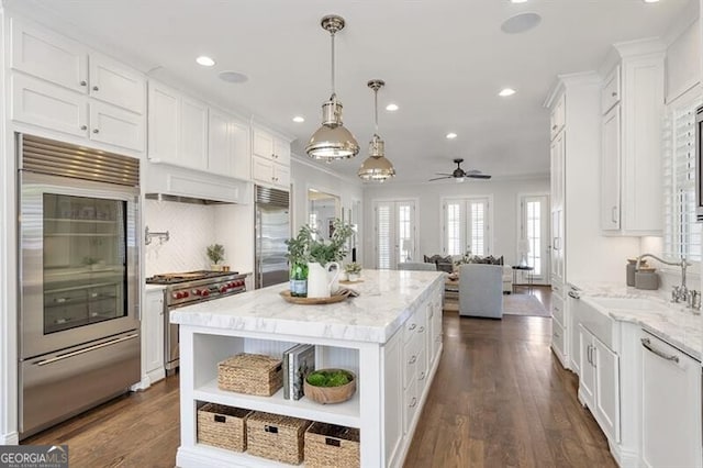885 Crabapple Hl, Milton, GA 30004 - kitchen featuring a kitchen island, pendant lighting, white cabinetry, sink, and high end appliances