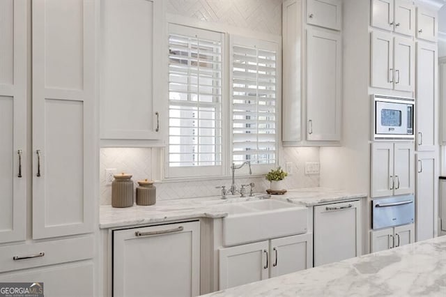 885 Crabapple Hl, Milton, GA 30004 - kitchen with white cabinetry, sink, stainless steel microwave, and white dishwasher