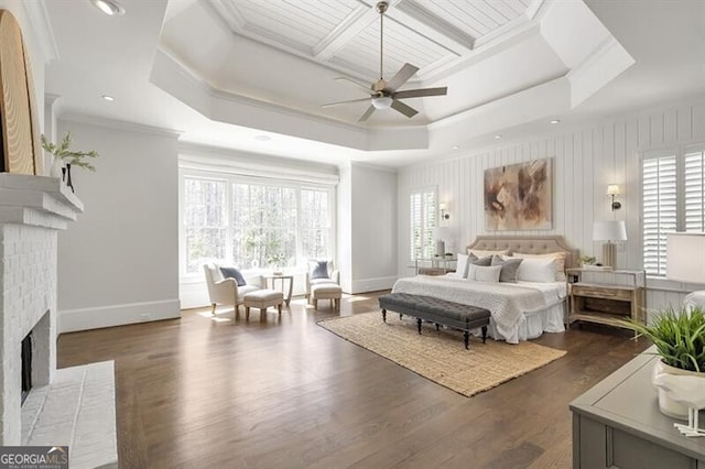 885 Crabapple Hl, Milton, GA 30004 - bedroom featuring a raised ceiling, crown molding, dark hardwood / wood-style flooring, and a fireplace