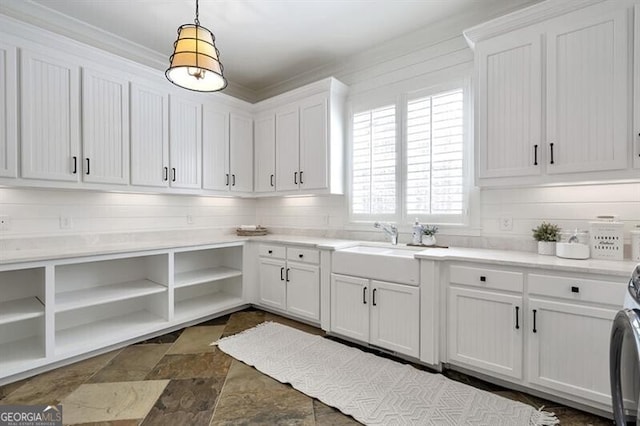 885 Crabapple Hl, Milton, GA 30004 - clothes washing area featuring cabinets, ornamental molding, and sink